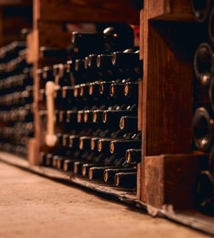 Wine bottles with corks stored in wine cellar