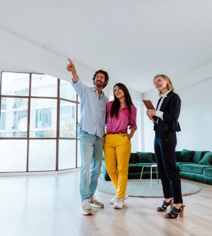 Real estate agent showing an apartment to a couple.